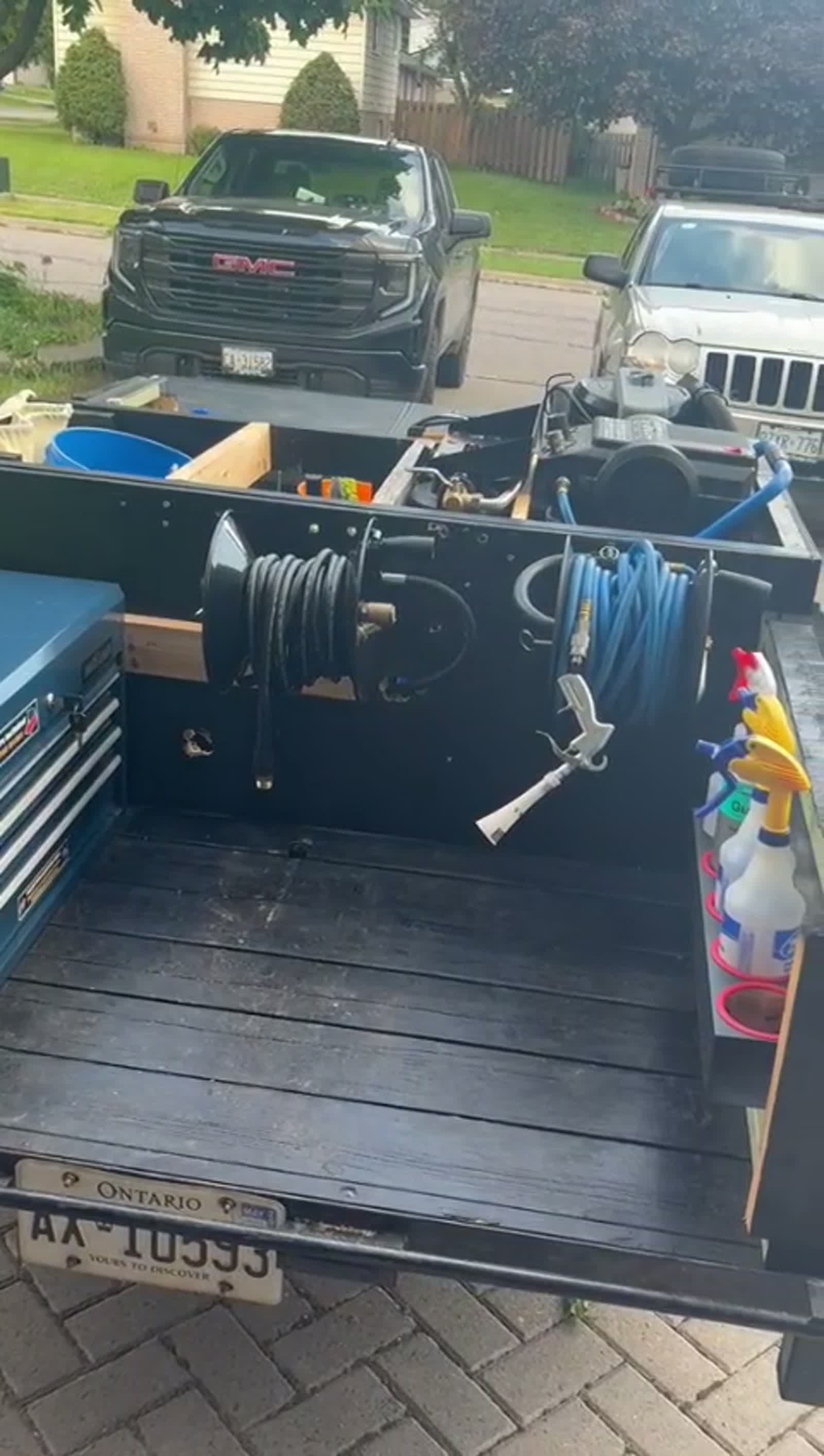 Hose reel, pressure washing gear and tool chest in the detailing trailer