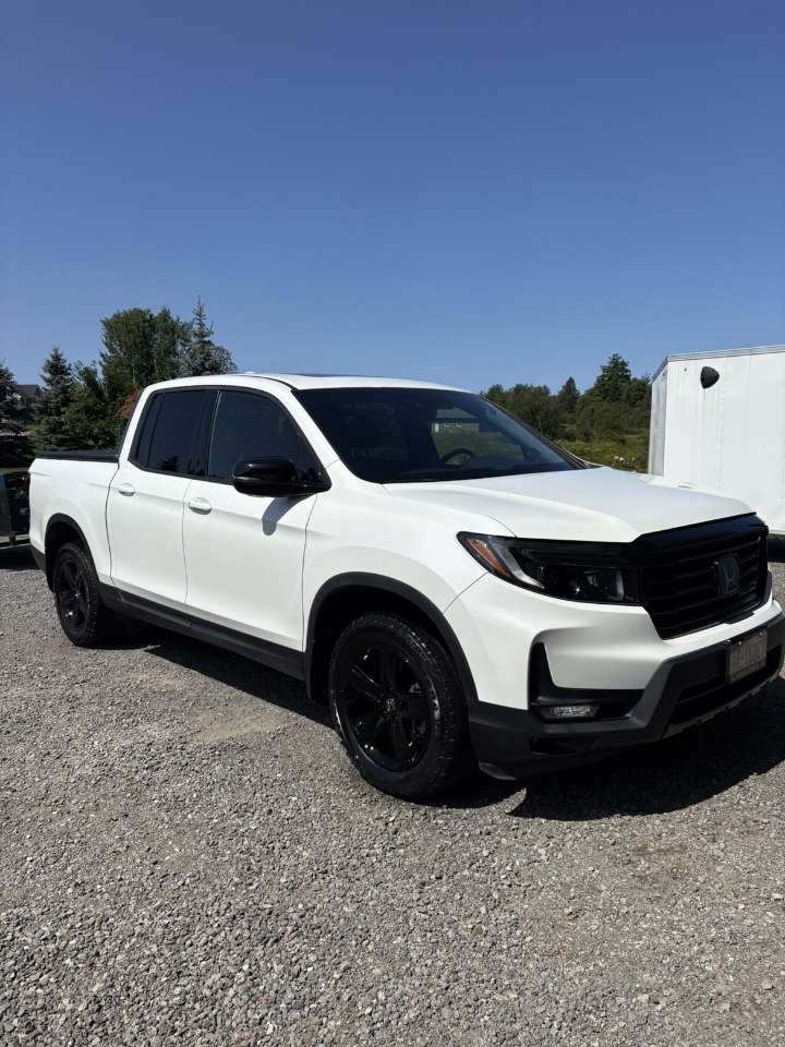 White Honda Ridgeline detailed with glossy paint
